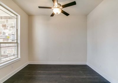 empty room with gray hardwood floors