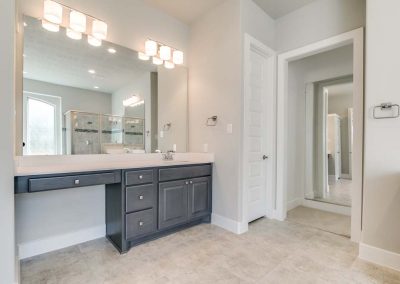 gray and white bathroom with sink and vanity counter